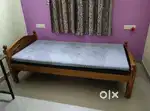 Wooden cot with orthopedic mattress