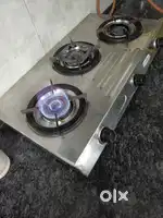 3 burner steel stove in use