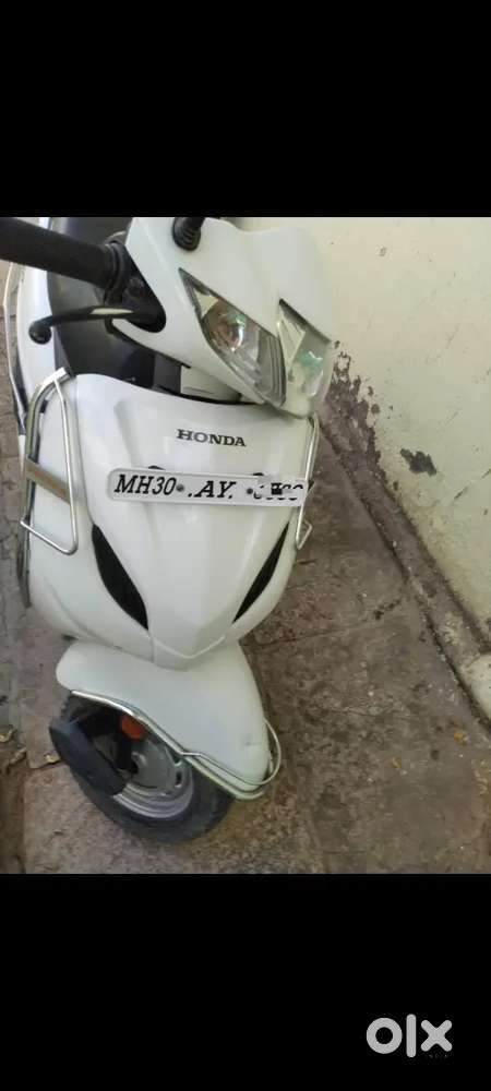 New battery tyre 90% original white colour one handed recently service