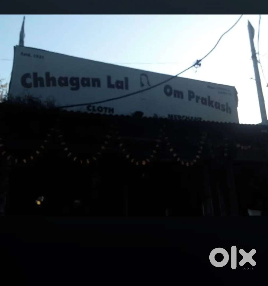 Salesmen and helper on a retail shop