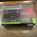 2and hand ASUS NVIDIA GeForce RTX 4070 Ti 12GB GDDR6X OC Edition GPU.