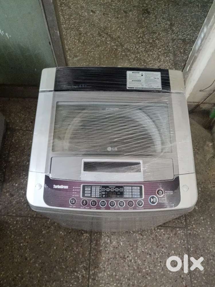 LG fuzzy logic 7 kg top load fully automatic washing