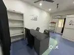 Full furnished office with table chair cabinet ac
