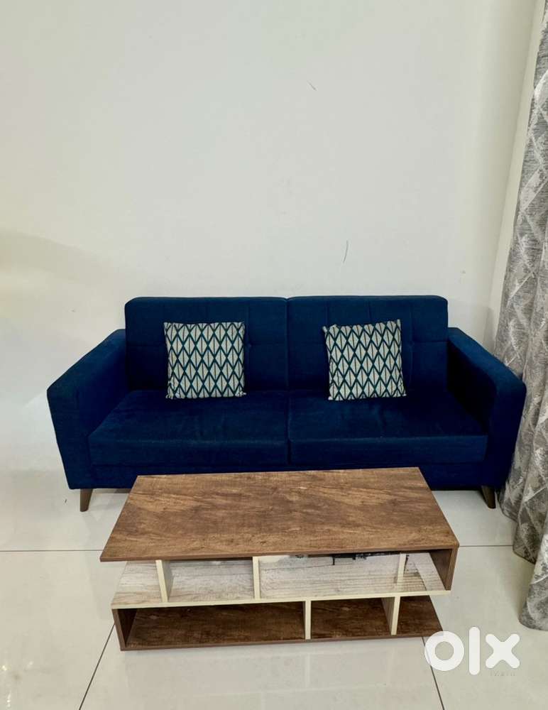 Three seater sofa set woth wooden coffee table