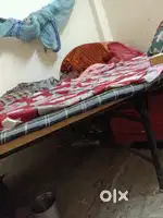 Two folding bed chair table