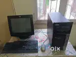 Old computer with keyboard and mouse.