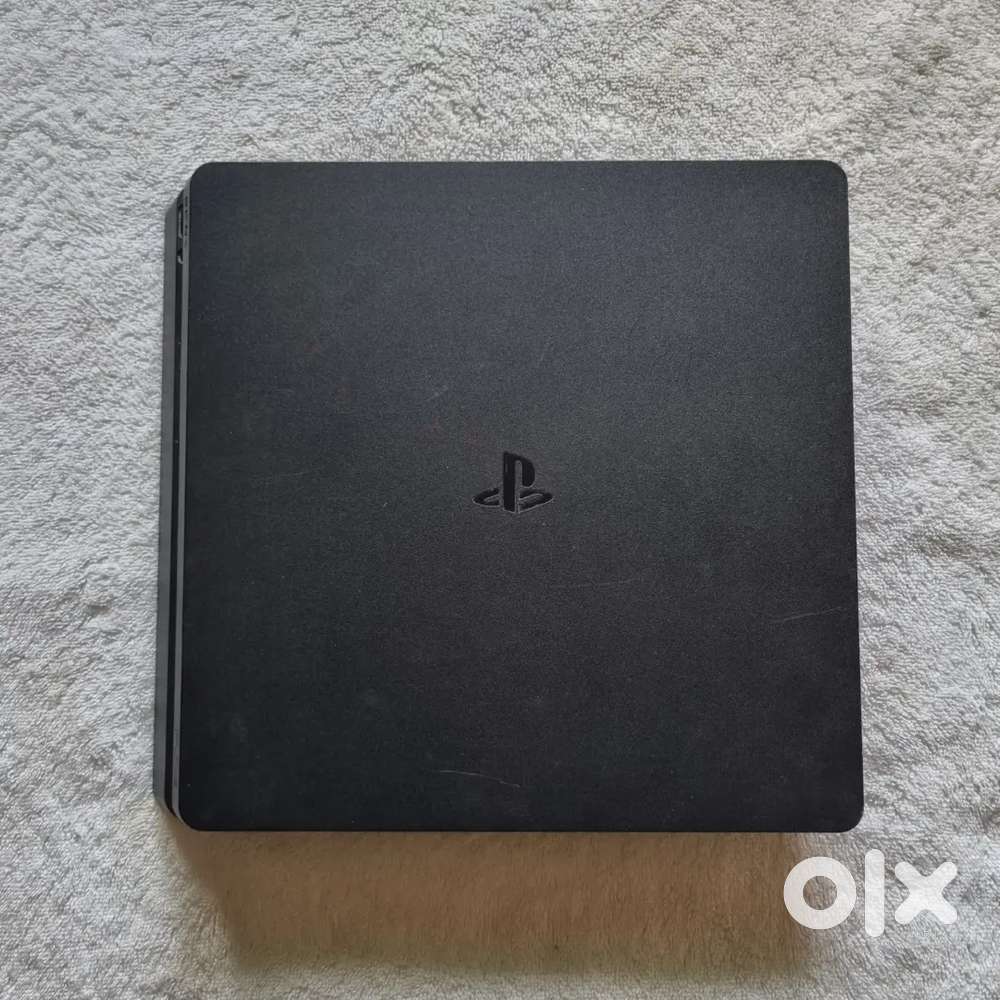 PS4 Slim with 2 Controllers & 4 Top Games!
