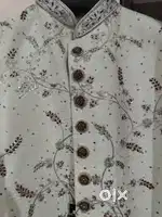 A new designer sherwani with stone working on it.