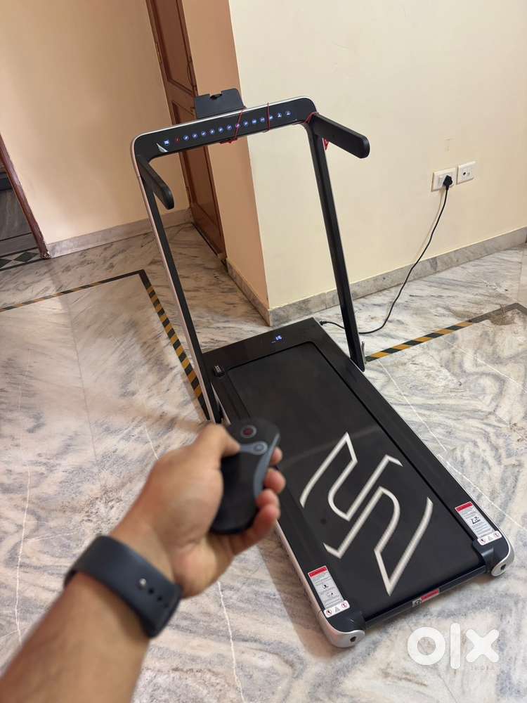 Foldable treadmill with remote