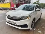 Honda Amaze 2018 next to showroom