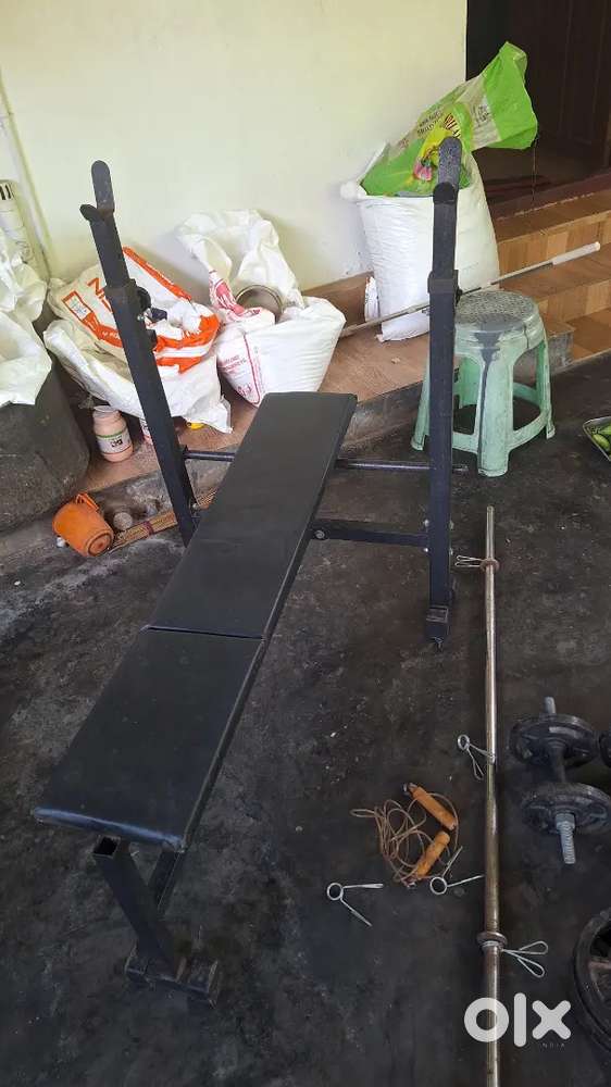 Gym barbells, dumbells and bench press