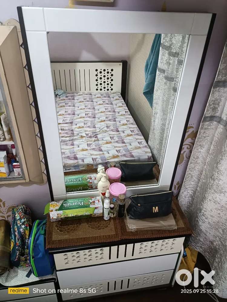 One big mirror and 3 drawers.