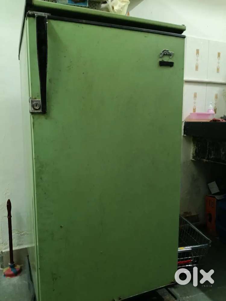 Second hand fridge at moderate working condition