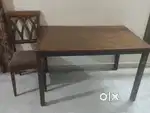 Four seater wooden dining table