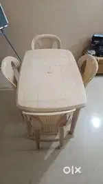 Plastic dining table with four chair