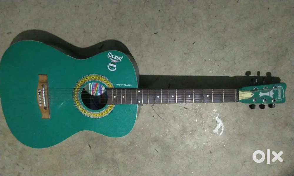Green givson guitar with all string