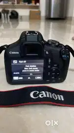 Canon EOS 1500D DSLR camera with 18-55mm lens, battery, charger, bag