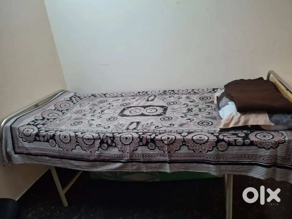 Strong and new single cot with bed included.