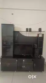 Tv unit which includes decorative item ,book shelf