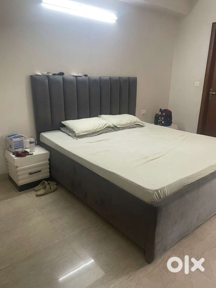 Double bed with two side table and mattresses