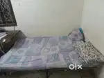 Folding bed with 2 mattress attached