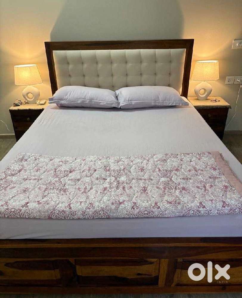 A beautiful teakwood bed with mattress available for sale