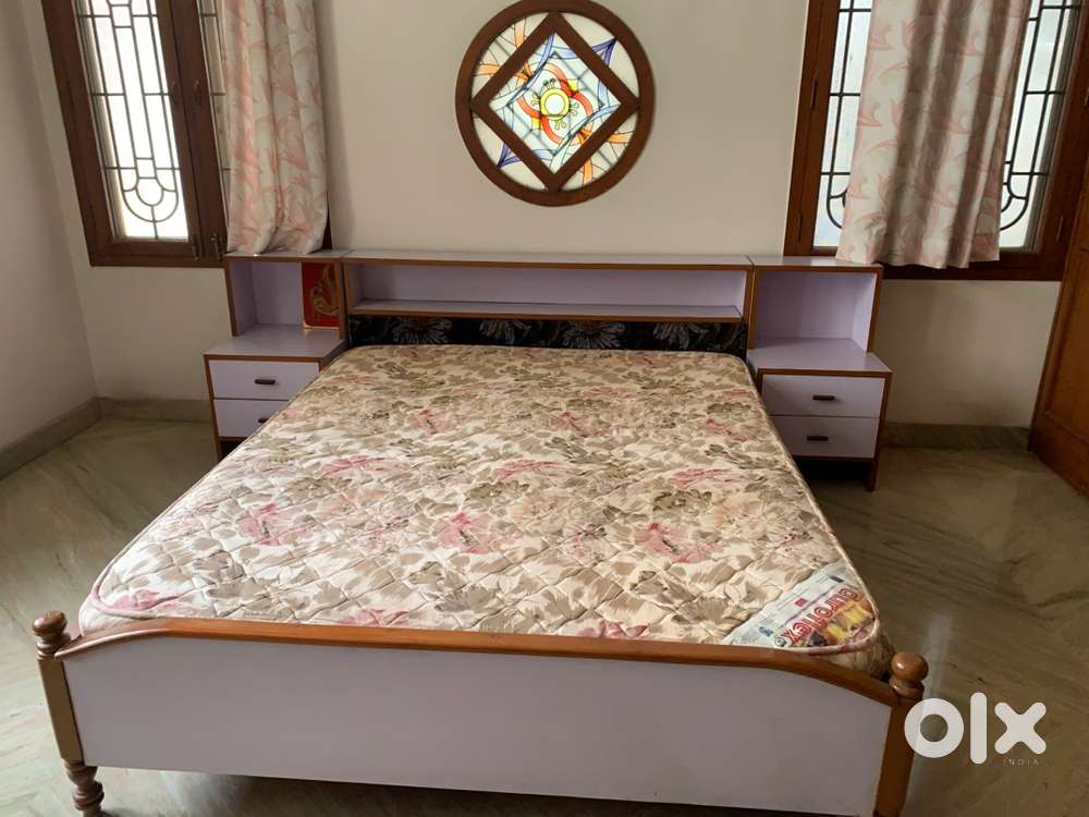 Double bed with foam mattress and side stool