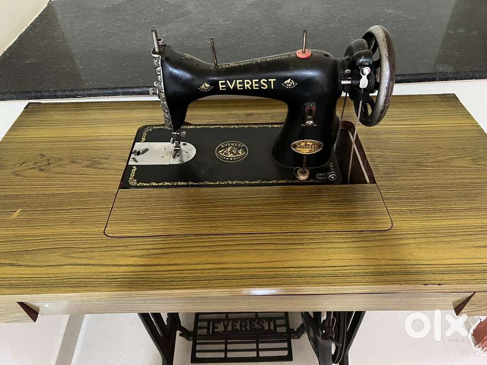 Everest foot operated sewing machine with table
