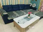 7.5 feet L shaped blue sofa only 6 months used