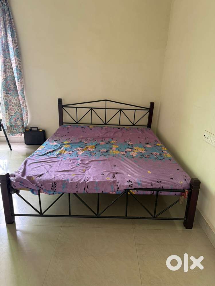 Queen size bed with wood and metal frame with matteress