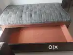 Single bed with storage and mattress.
