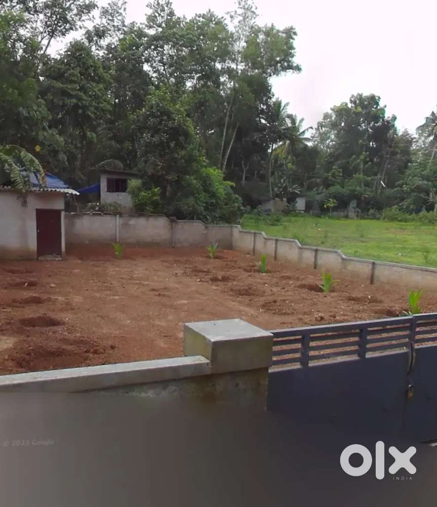 Compound wall with gate. Lorry site. Panchayat tar road frontage