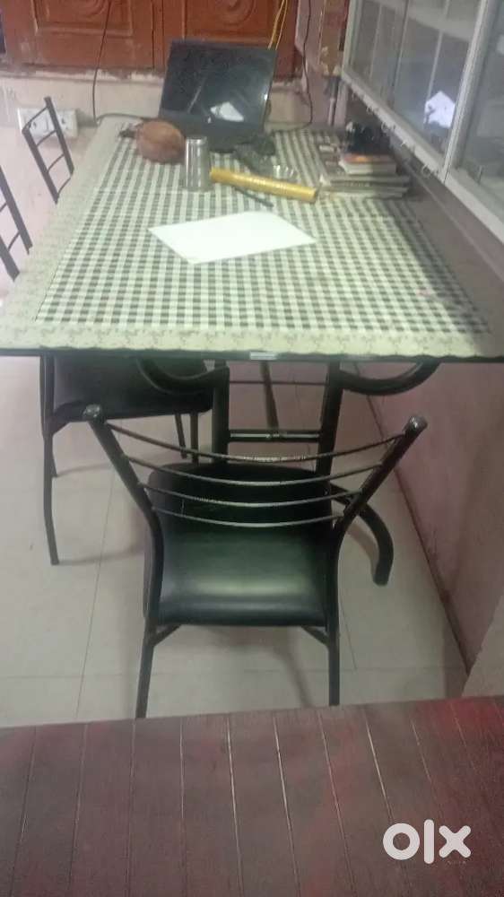 Glass top dining table with 6 chair and cover