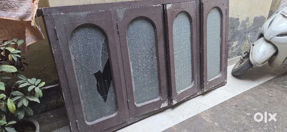 Wooden window with heavy iron grill