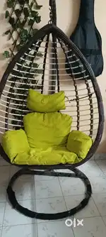 Swing with green cushion