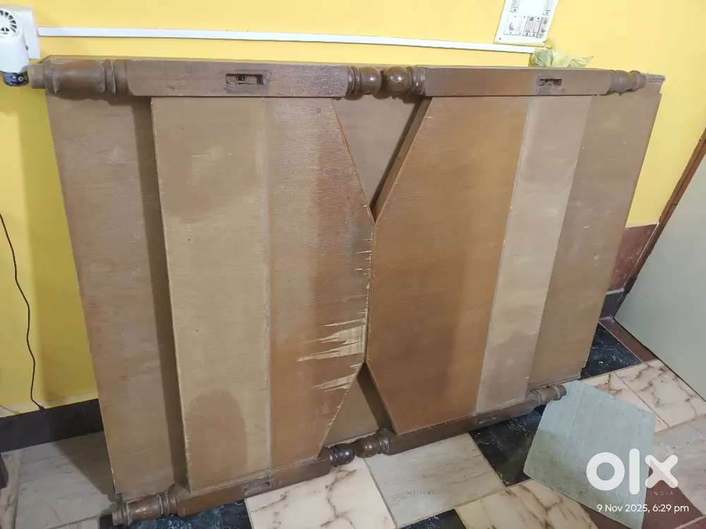 Wooden cot with mattress