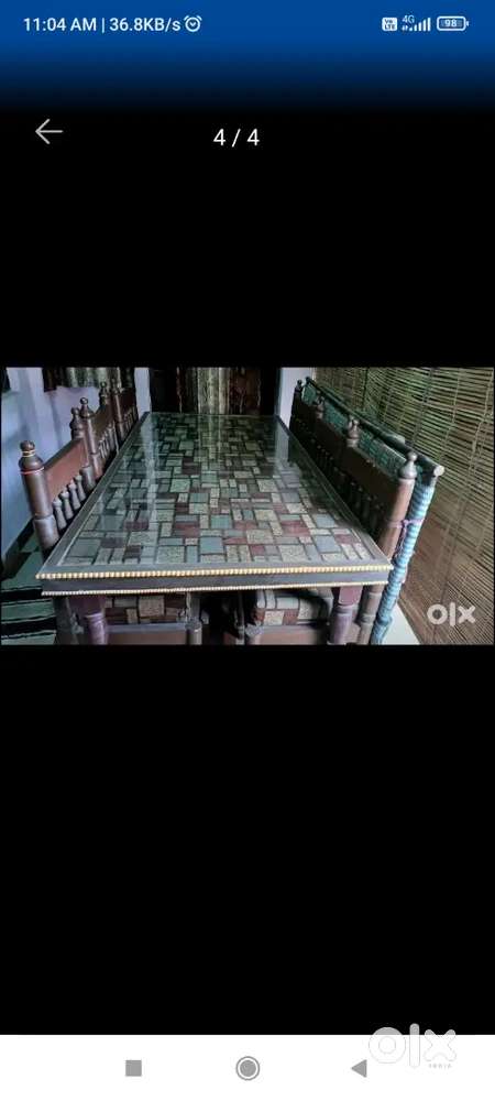 A DINNING TABLE WITH 6 CHAIRS