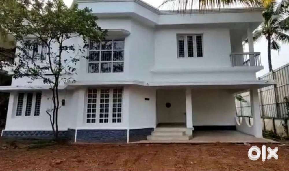 A plot in aluva which have a 2000 sq ft 2 storied house in 18.5 cents