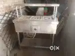 Food warmer with steel table