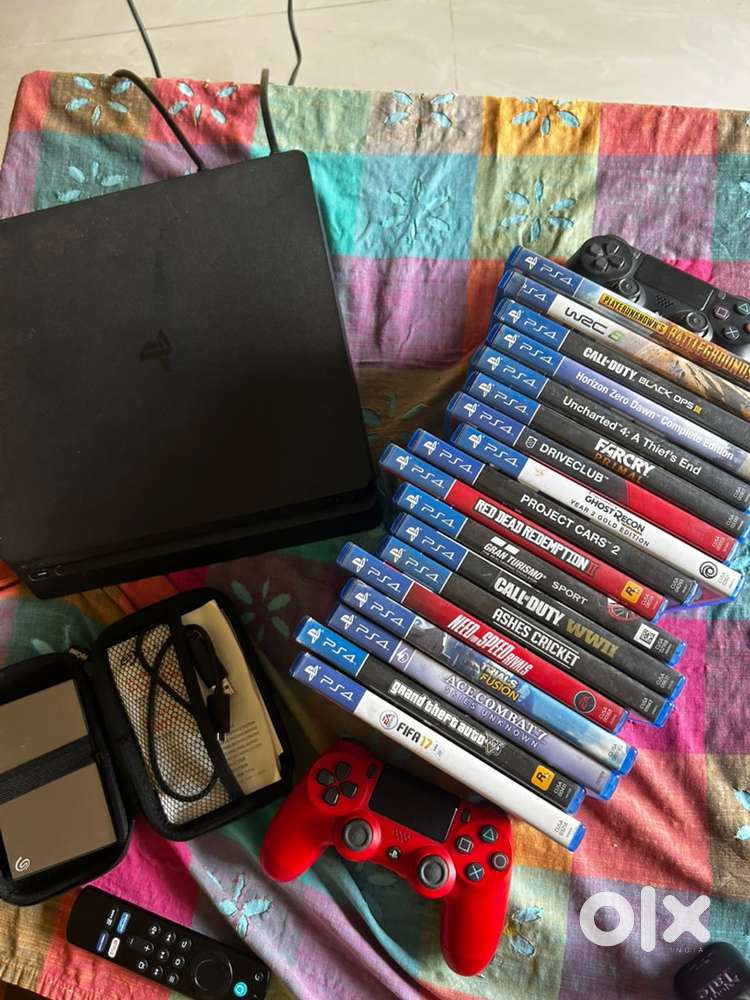 Ps 4 slim with 18 games 2 tb hard drive, hard drive case, 2 controller