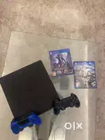 Ps4 with two controllers with god of war and devil may cry