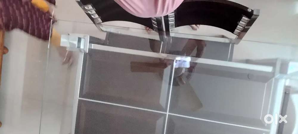 A glass top dining table