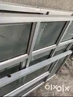 Aluminium window frame with glass
