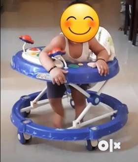 Baby walker in good condition is on sale. Walker has solid back support, adjustable height and music...