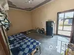 Fully furnished room with bed cooler fridge sofa