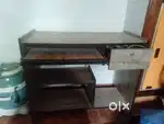 THE COMPUTER TABLE WITH THE CHAIR WITH CUSHION