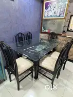 Dining table made with teak wood and recently polished
