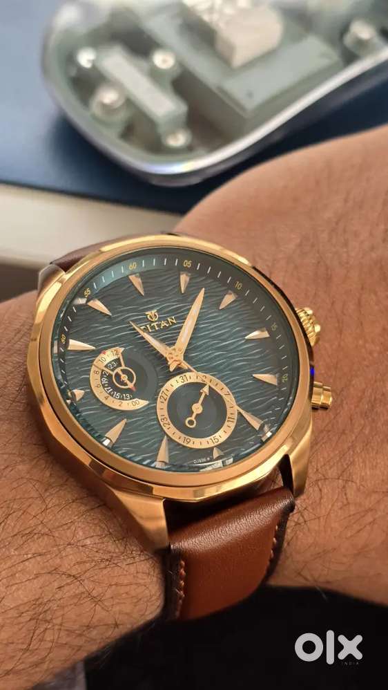 Titan Maritime multifunction watch with a sea-green dial, gold-toned