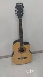 Beige Guitar - 1 year old and marked