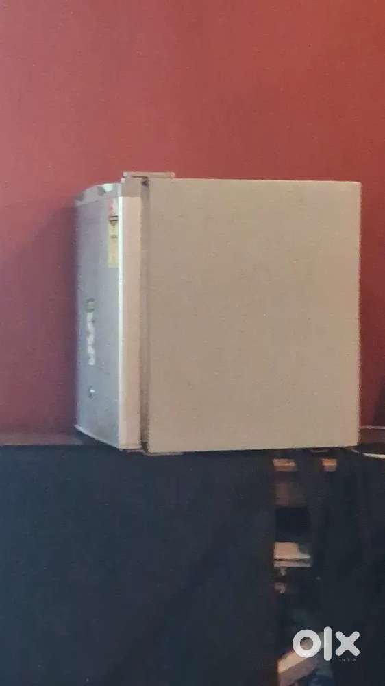 2 Yr old mini fridge on sale.